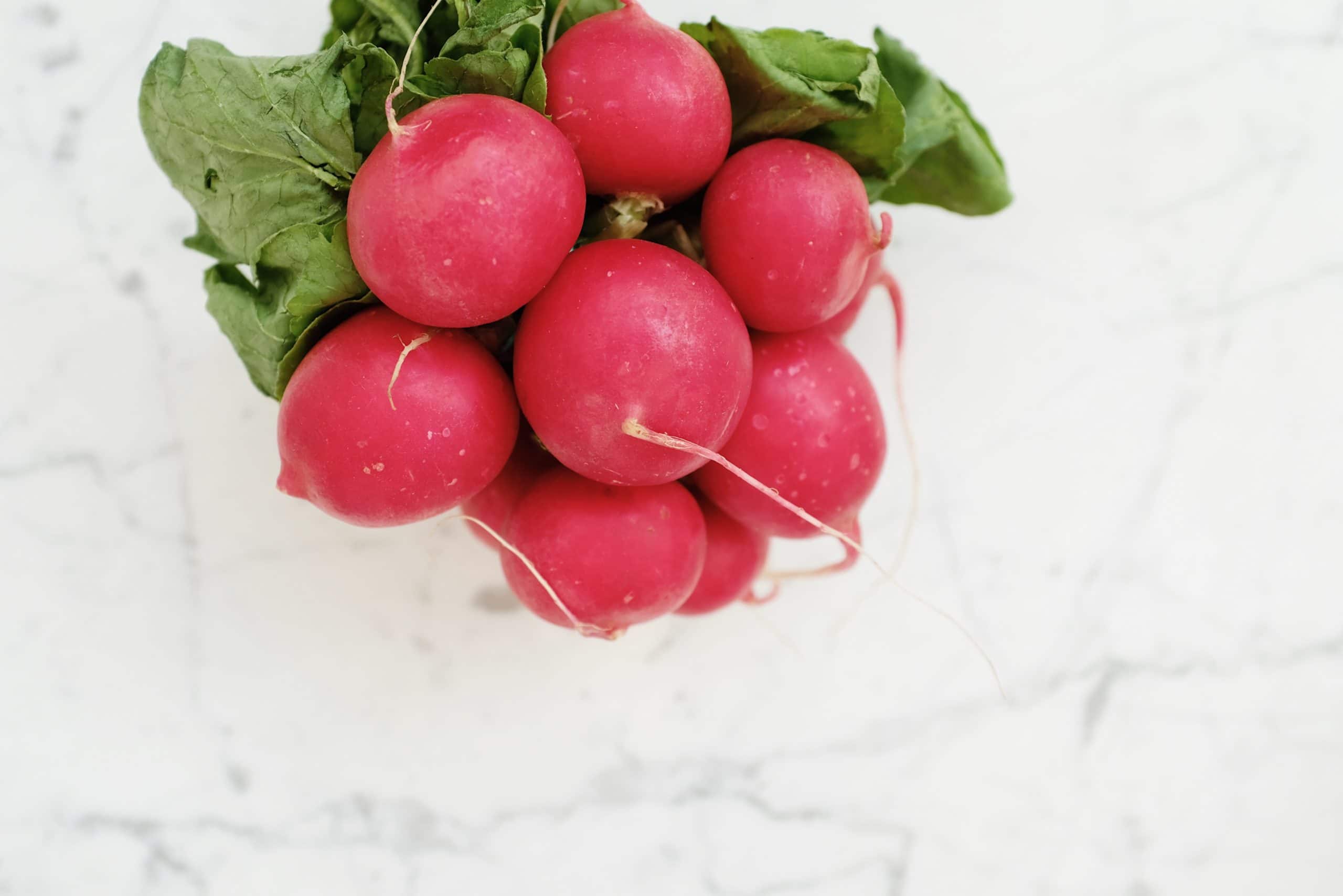 Red radishes on countertop.