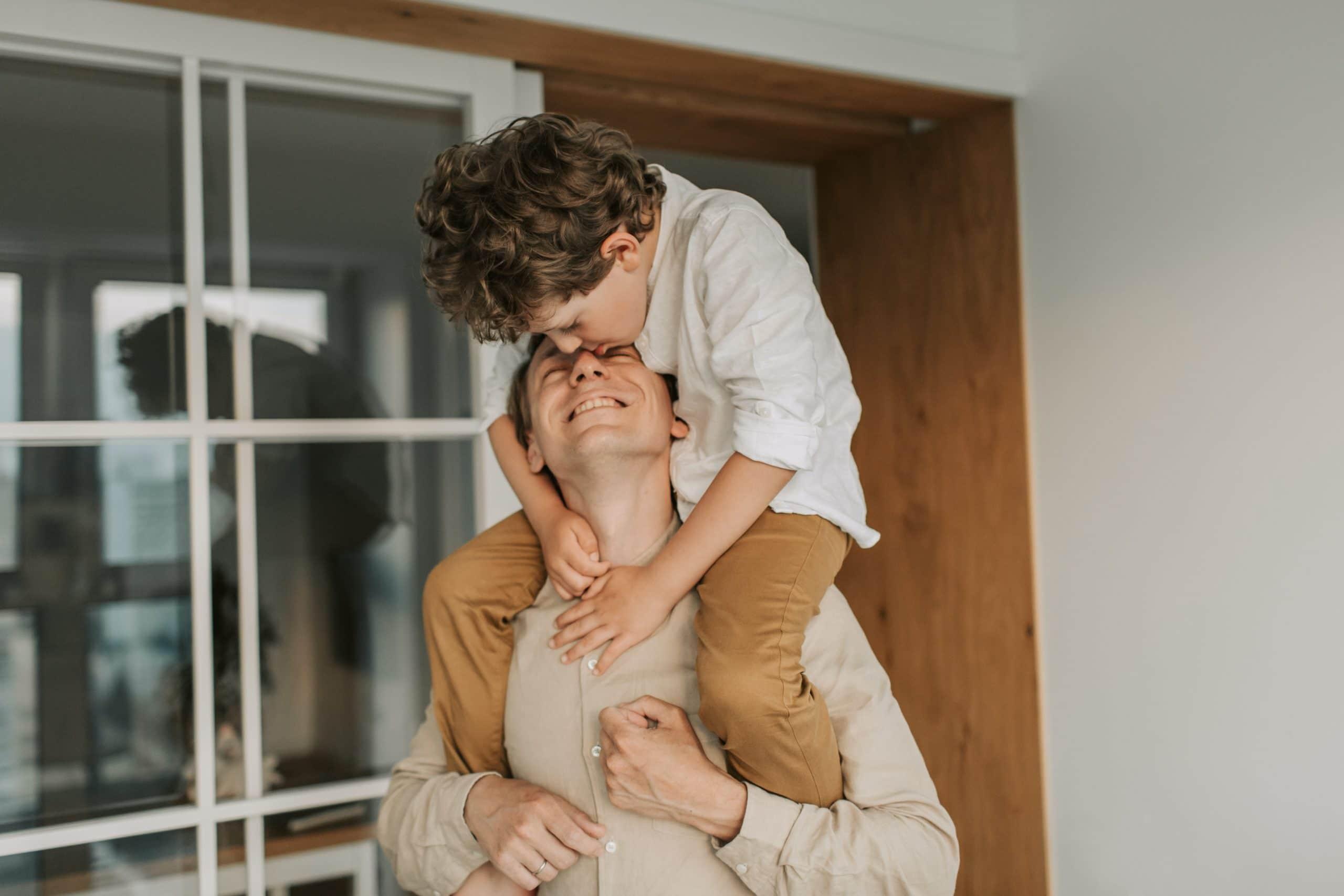 Young boy on his father's shoulders