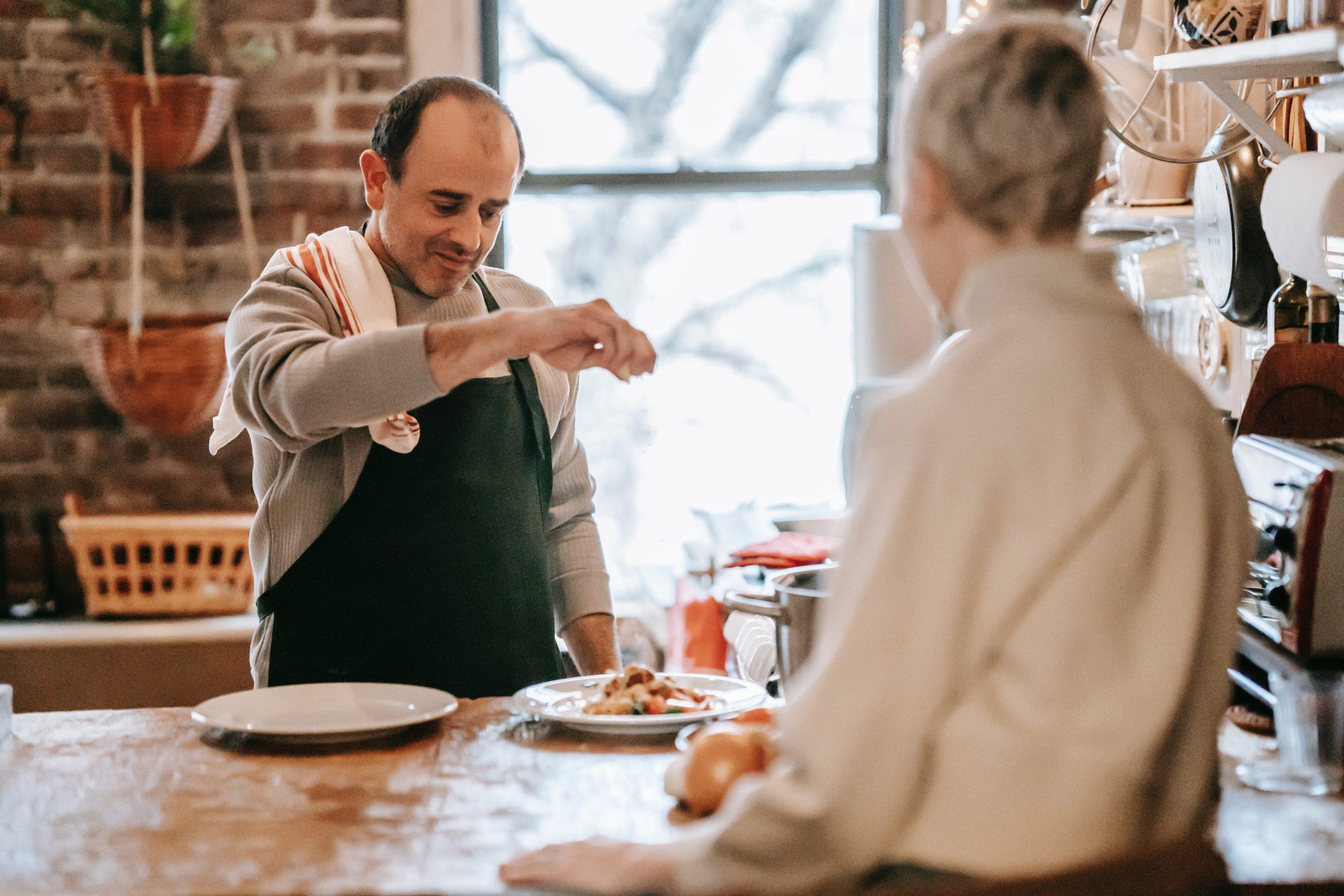 Man seasoning food