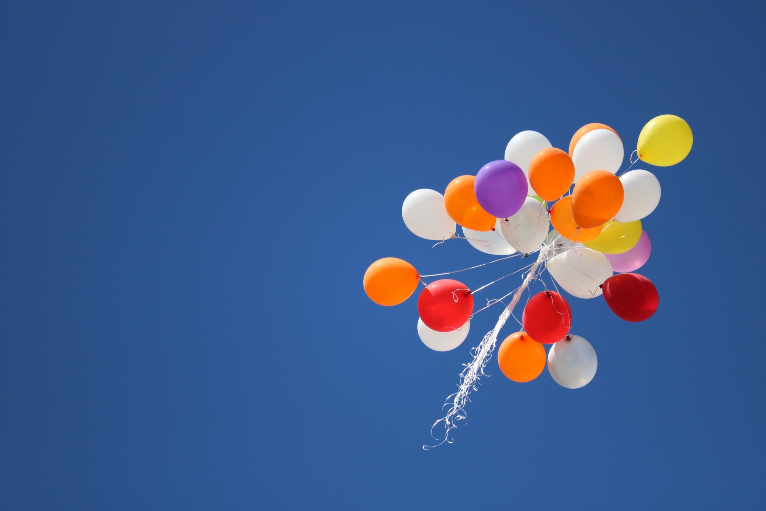 rainbow balloons in sky