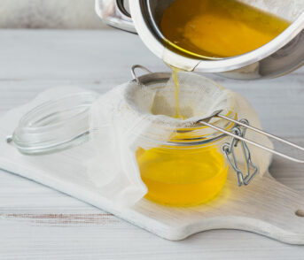 Preparation of Ghee or a clarified butter. Healthy fat diet concept